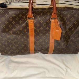 Well loved Louis Vuitton overnight bag